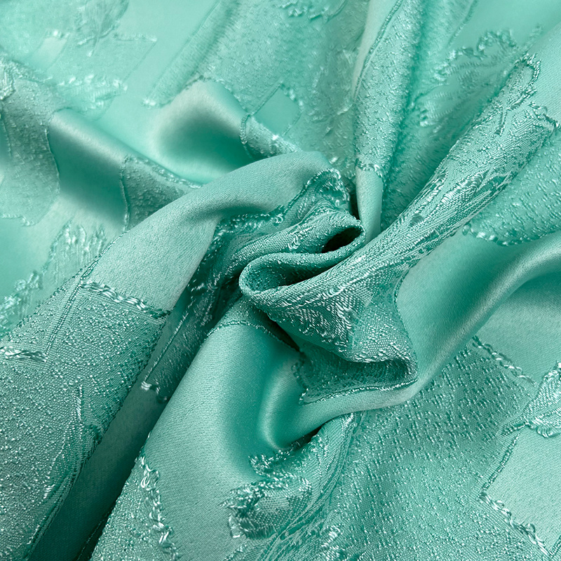 Dekorační látka Estella listy zelená - šířka 160 cm, metráž